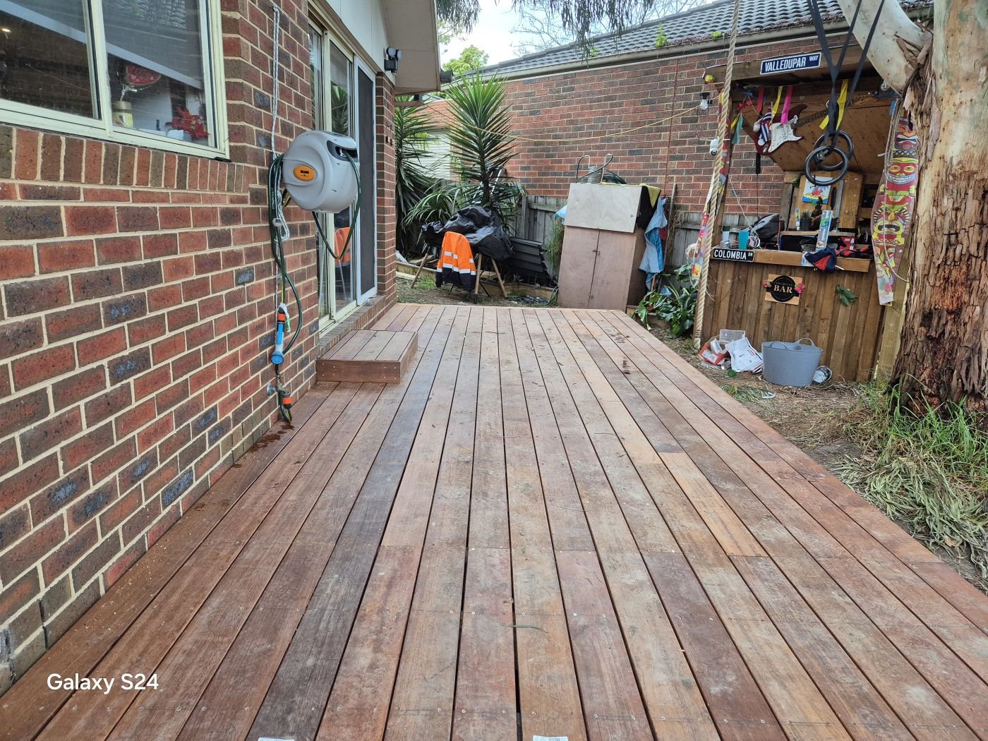 Long merbau deck along a side yard