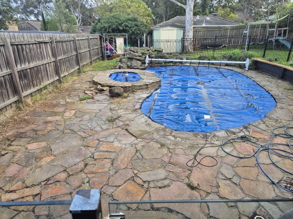 Old cracked flagstone pool surround before renovation in Melbourne