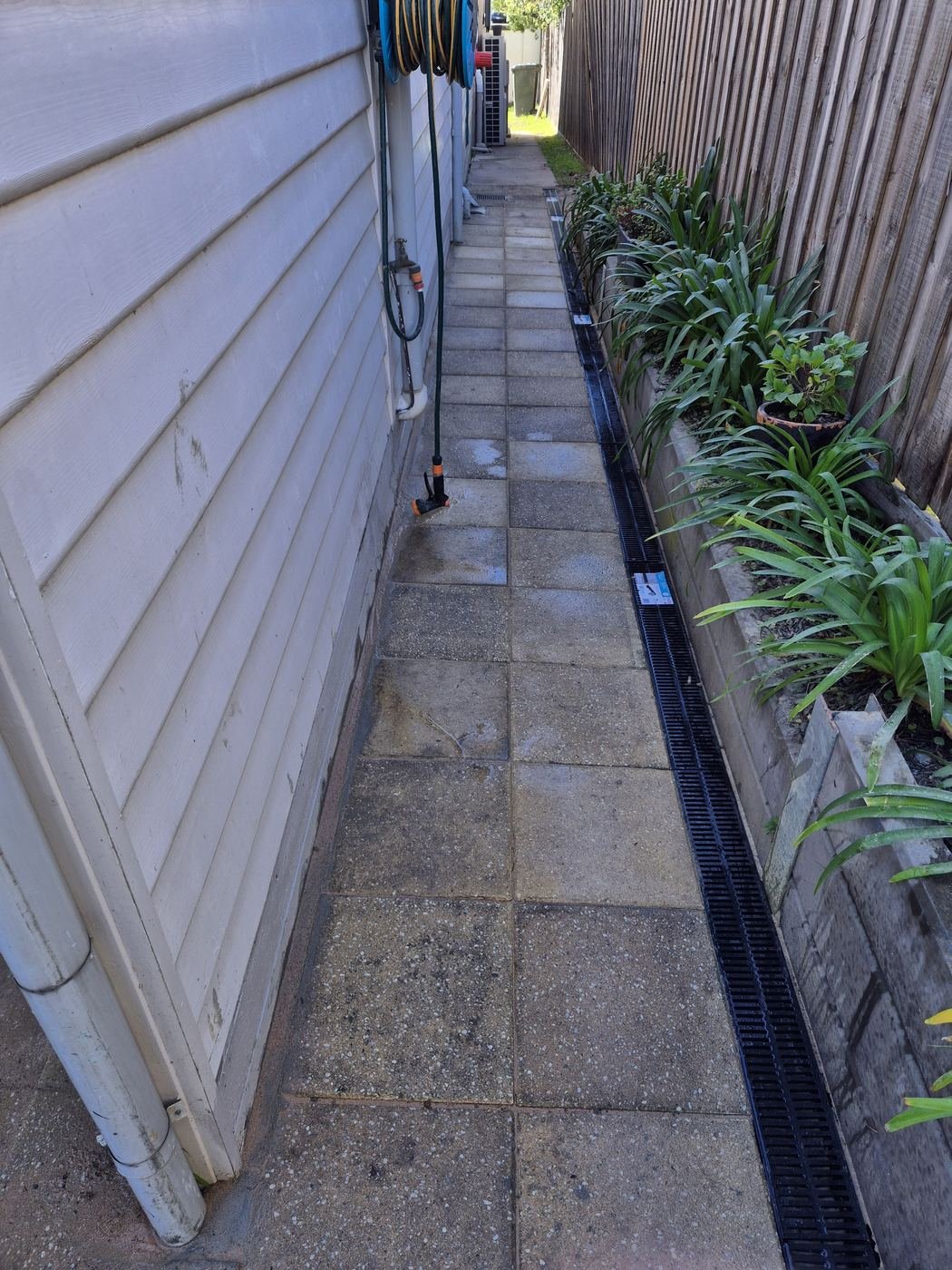 Strip drain along a paved side path